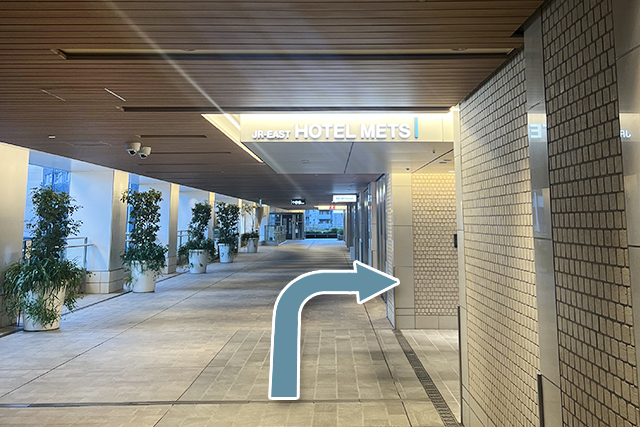 4.Enter through the entrance marked by the HOTEL METS logo; the front desk will be on your right.
